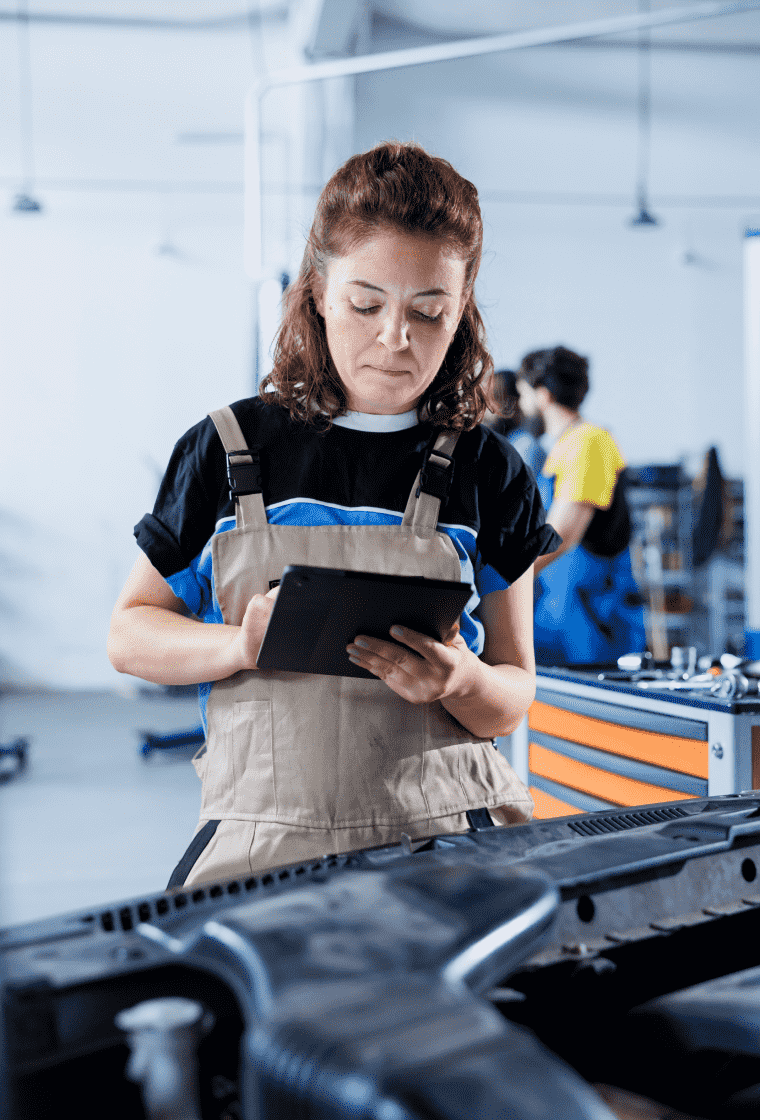 Woman in a factory with a tablet